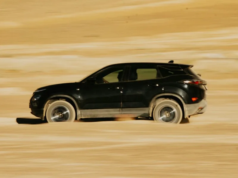 A luxury SUV on a mountain road